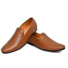 Close-up view of the textured leather upper of tan slip-on shoes Close-up view of the textured leather upper of tan slip-on shoes