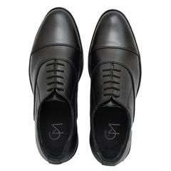 Comfortable black leather oxfords featuring high-quality craftsmanship by Country Maddox. Comfortable black leather oxfords featuring high-quality craftsmanship by Country Maddox.