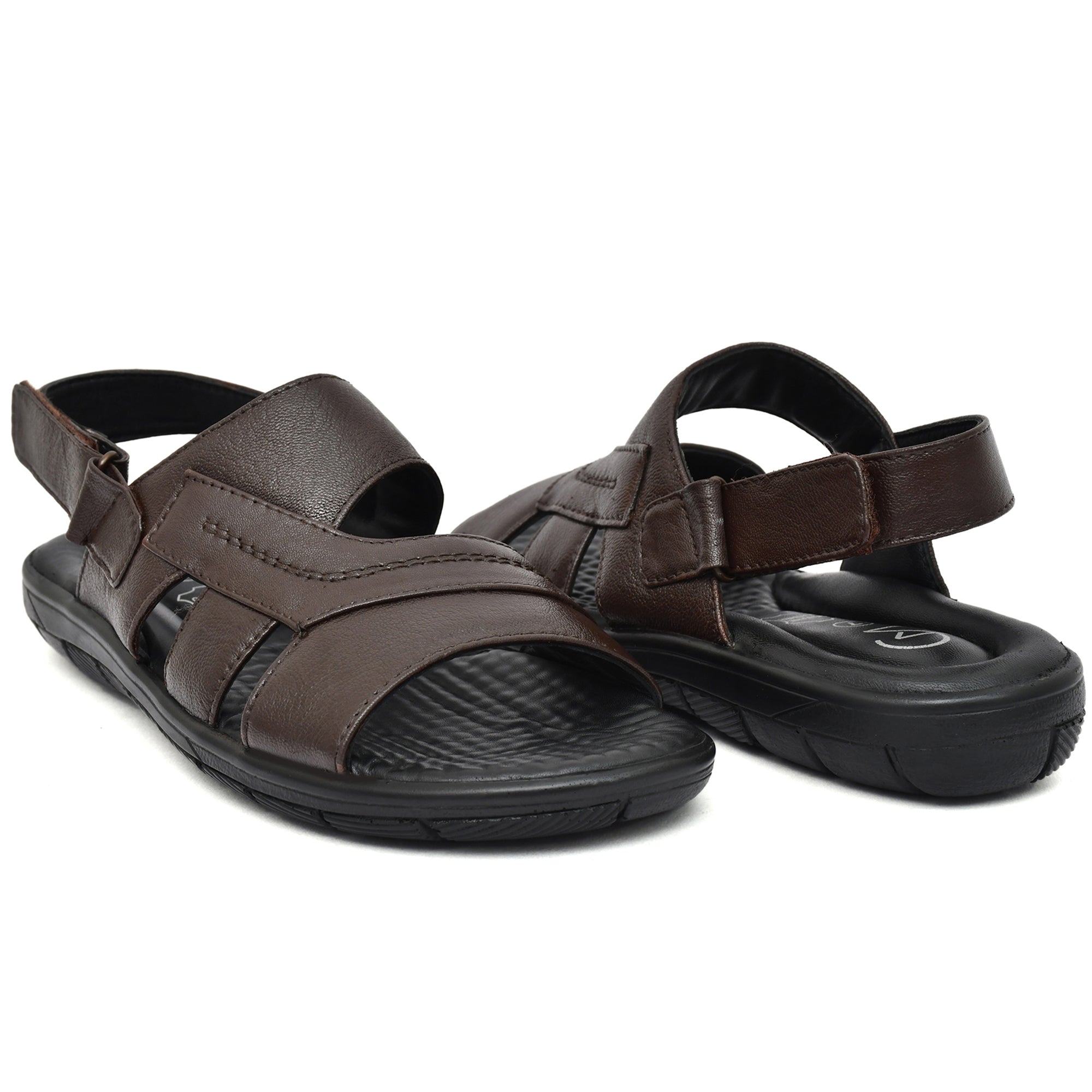 Stylish brown leather sandals for men with a classic slip-on design. Stylish brown leather sandals for men with a classic slip-on design.