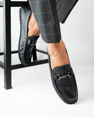Man wearing Country Maddox Black Leather Loafers, showcasing comfort and style. Man wearing Country Maddox Black Leather Loafers, showcasing comfort and style.