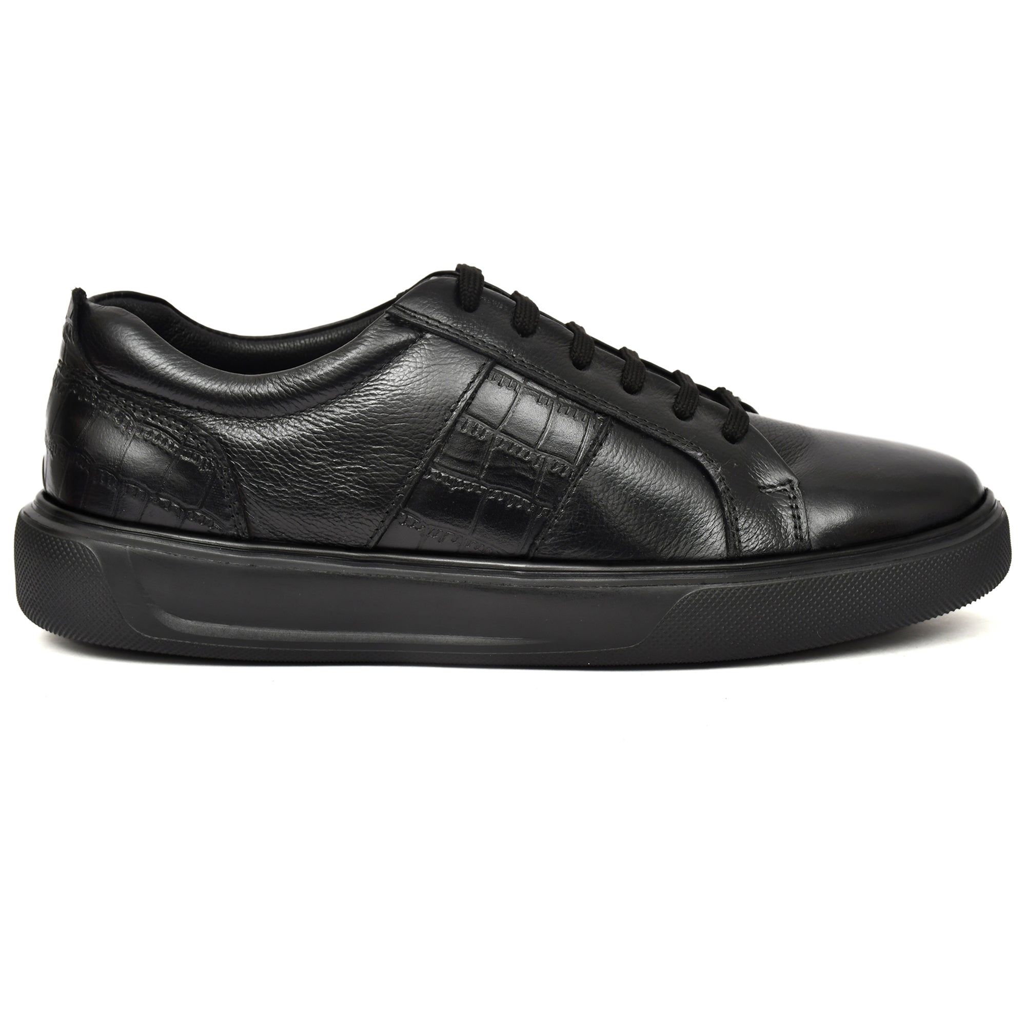 Side view of black leather sneakers from Country Maddox Side view of black leather sneakers from Country Maddox