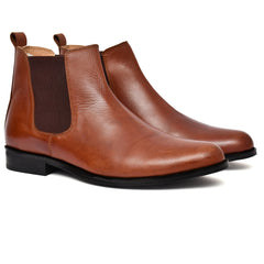 Stylish tan leather boots from Country Maddox on a white background. Stylish tan leather boots from Country Maddox on a white background.