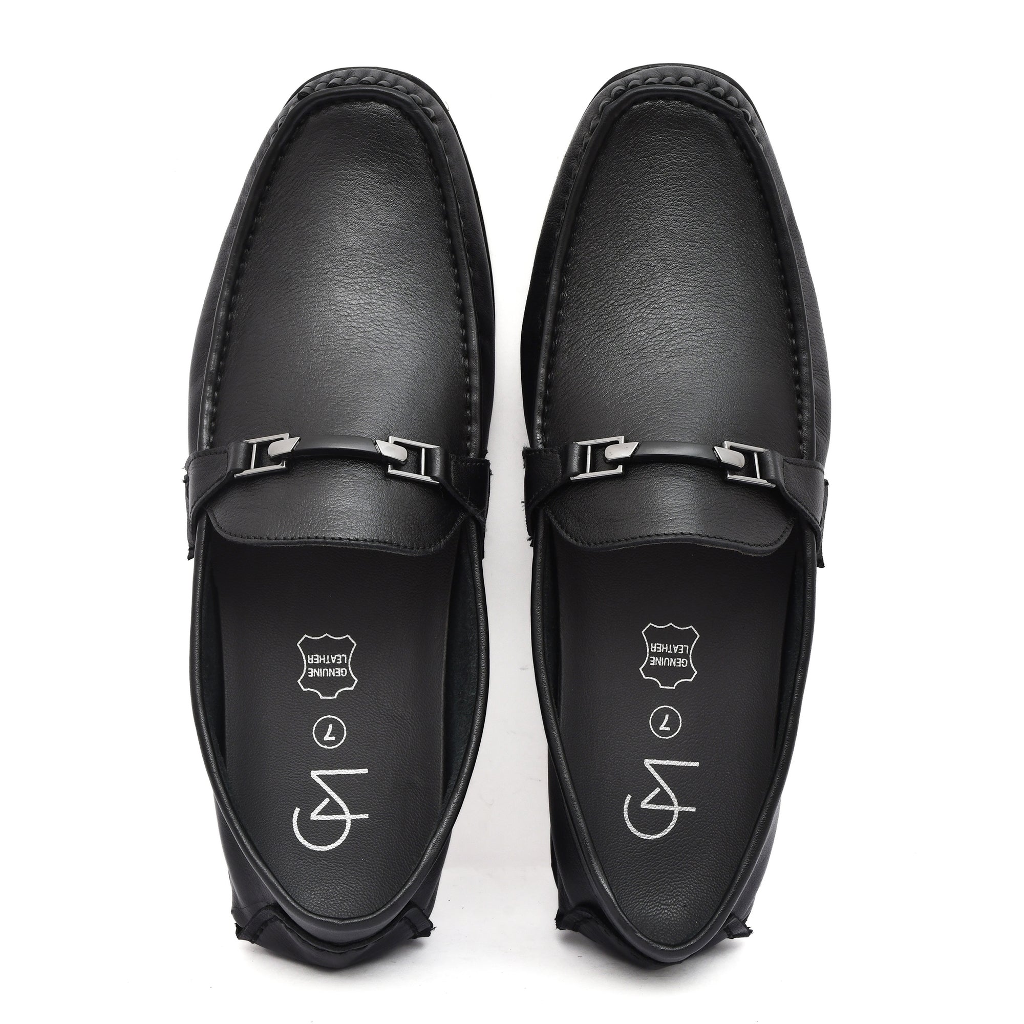Styled shot of black leather loafers paired with casual outfit, perfect for versatile occasions. Styled shot of black leather loafers paired with casual outfit, perfect for versatile occasions.