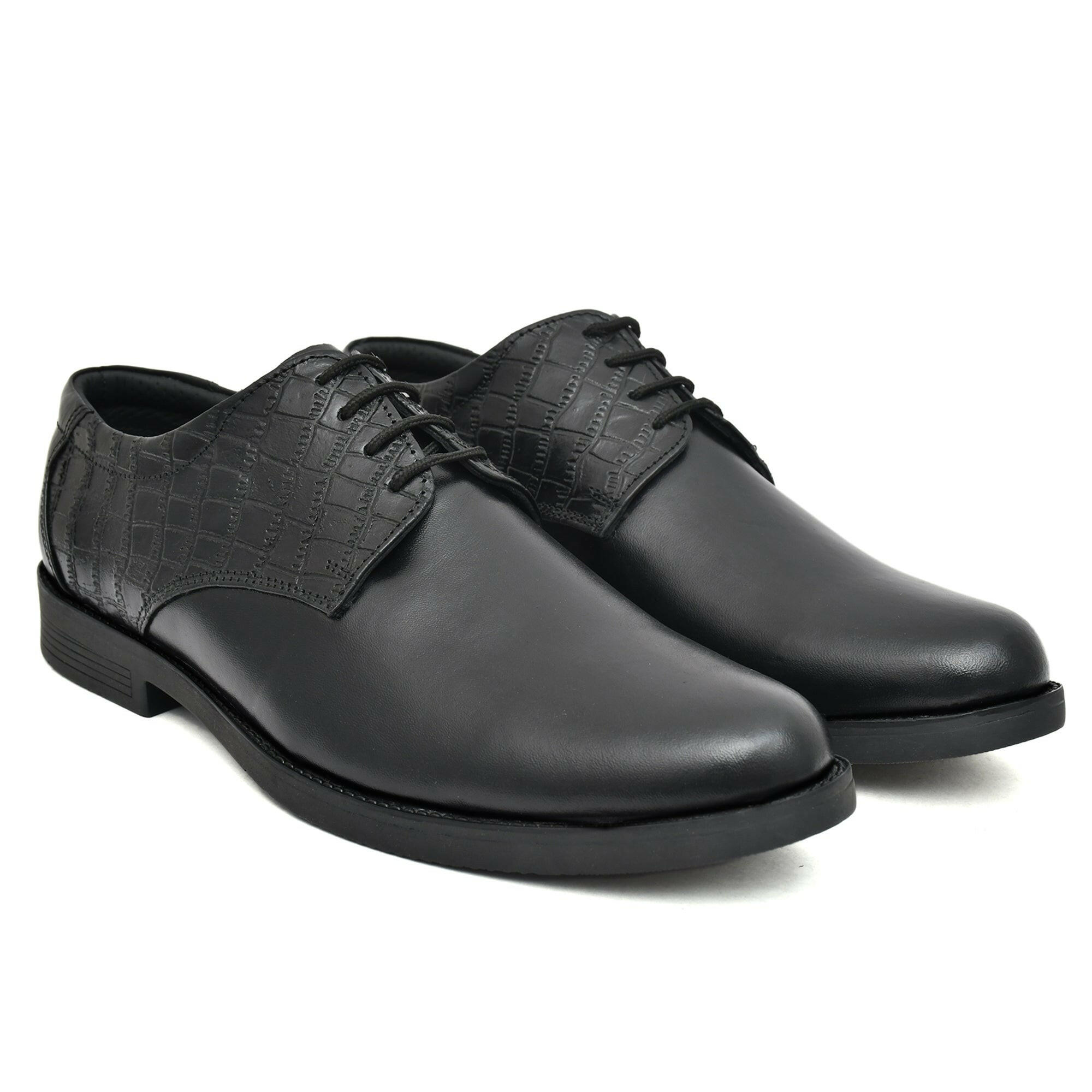 Close-up of the black leather derby shoe showcasing fine craftsmanship. Close-up of the black leather derby shoe showcasing fine craftsmanship.