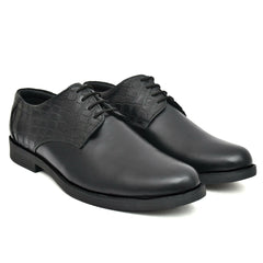 Close-up of the black leather derby shoe showcasing fine craftsmanship. Close-up of the black leather derby shoe showcasing fine craftsmanship.