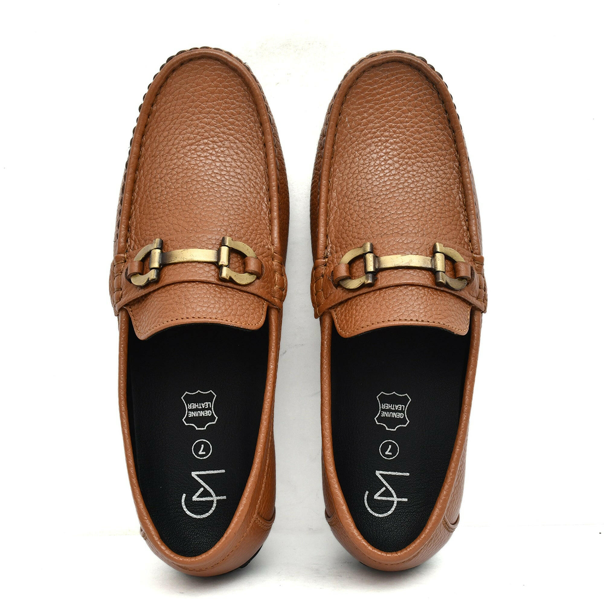 Country Maddox tan leather loafers on display, emphasizing comfort and elegance. Country Maddox tan leather loafers on display, emphasizing comfort and elegance.