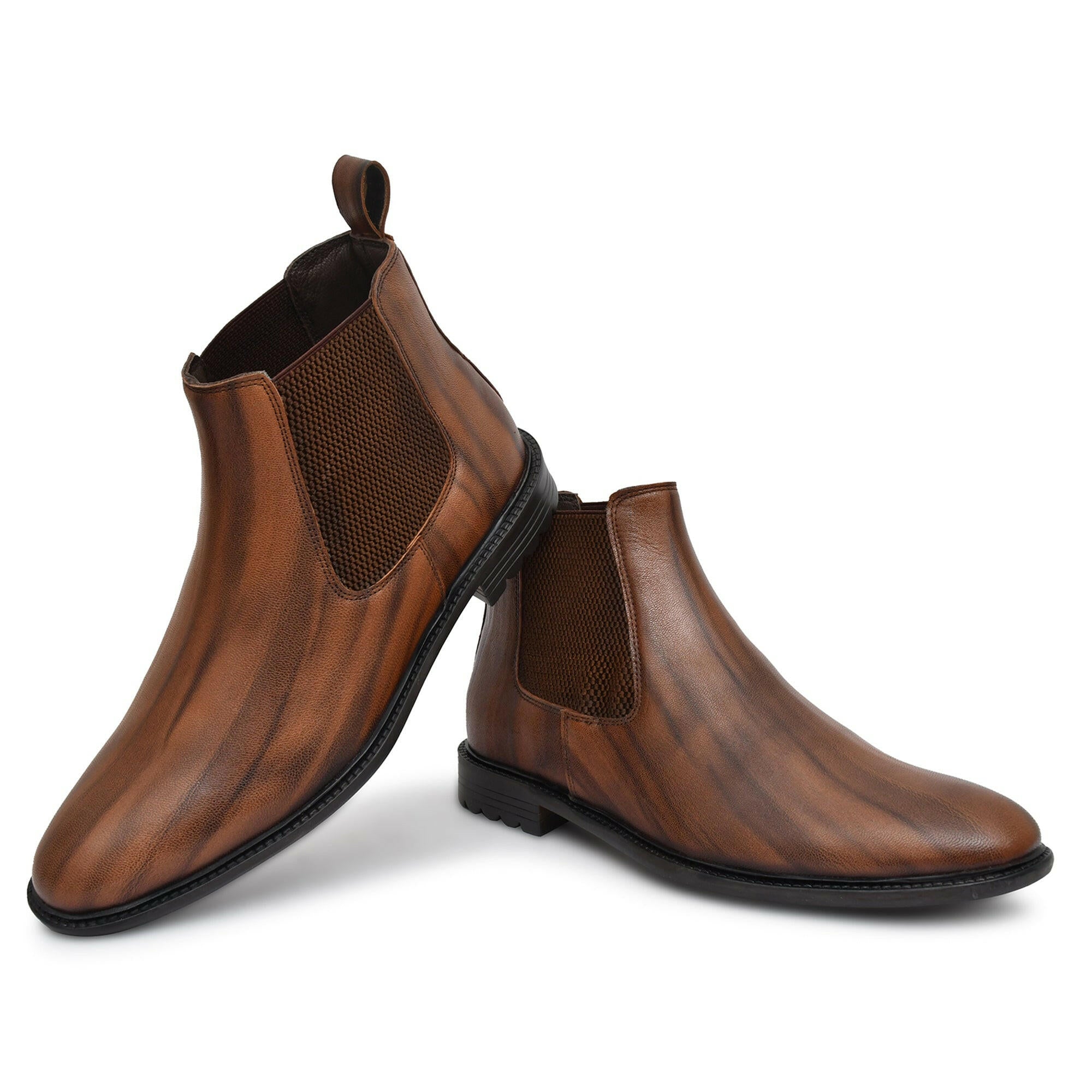 Brown leather boots paired with casual attire, showcasing versatility. Brown leather boots paired with casual attire, showcasing versatility.