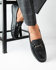 Man wearing Country Maddox Black Leather Loafers, showcasing comfort and style.